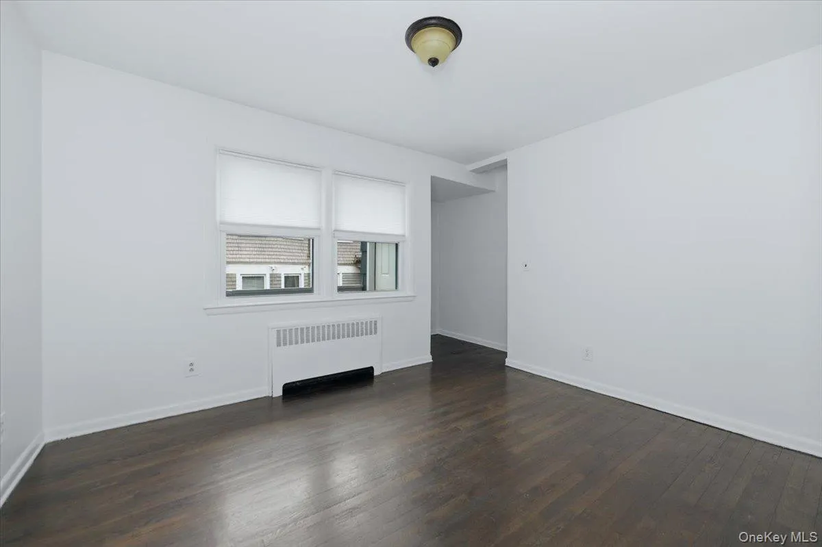 Primary bedroom - with ensuite .5 bath, wood floors, alcove, separate private entrance, coat closet and 2 windows Primary bedroom - with ensuite .5 bath, wood floors, alcove, separate private entrance, coat closet and 2 windows