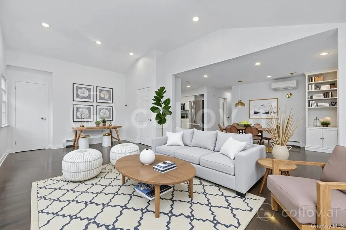 Virtually Staged family room with dining area in background and kitchen Virtually Staged family room with dining area in background and kitchen