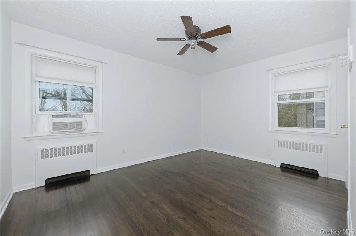 3rd Bedroom - wood floors, ceiling fan, two windows and closet 3rd Bedroom - wood floors, ceiling fan, two windows and closet