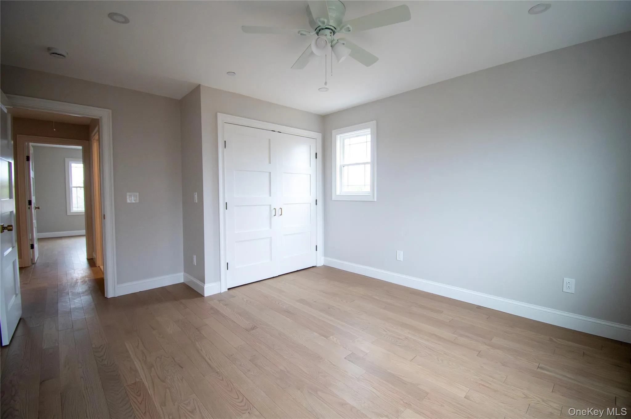 Unfurnished bedroom with light wood finished floors, a ceiling fan, a closet, and recessed lighting Unfurnished bedroom with light wood finished floors, a ceiling fan, a closet, and recessed lighting