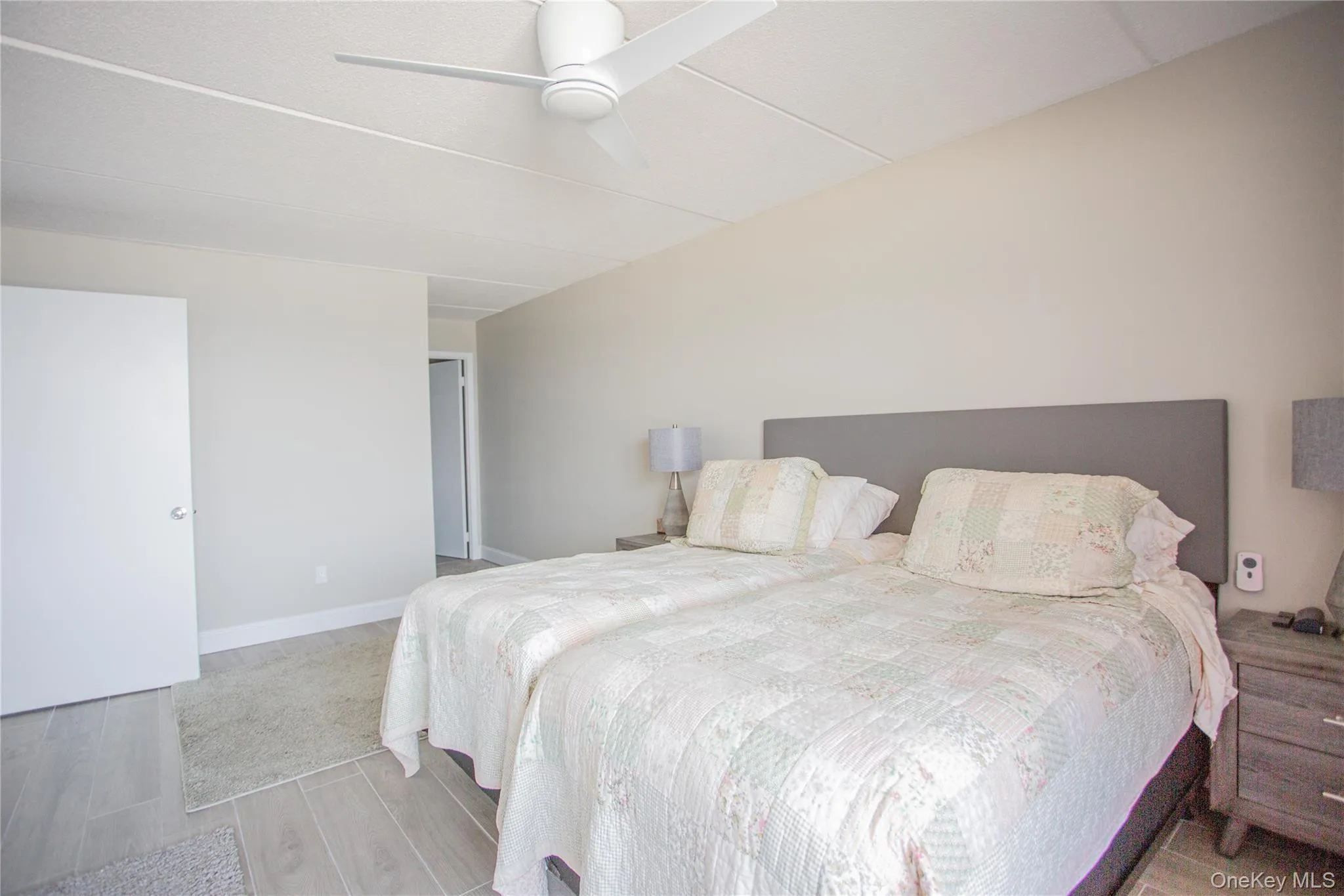 Bedroom featuring wood finished floors and ceiling fan Bedroom featuring wood finished floors and ceiling fan