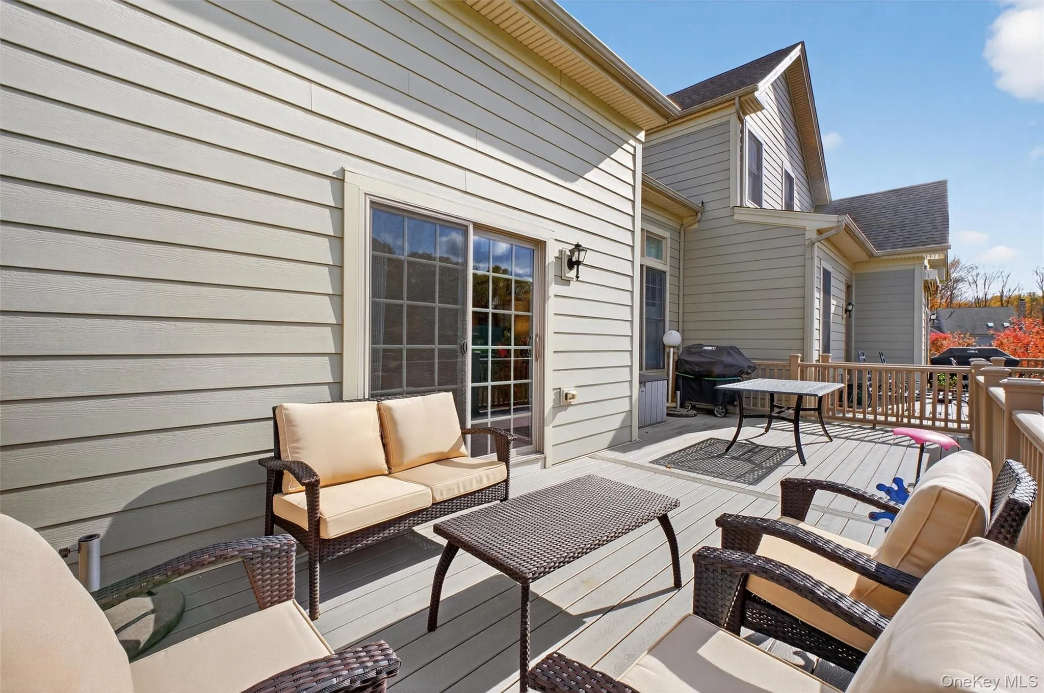 Wooden terrace with an outdoor hangout area and grilling area Wooden terrace with an outdoor hangout area and grilling area