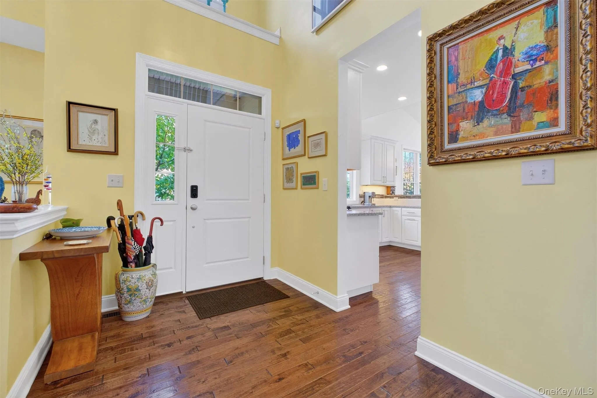 Foyer featuring recessed lighting, healthy amount of natural light, and dark wood finished floors Foyer featuring recessed lighting, healthy amount of natural light, and dark wood finished floors