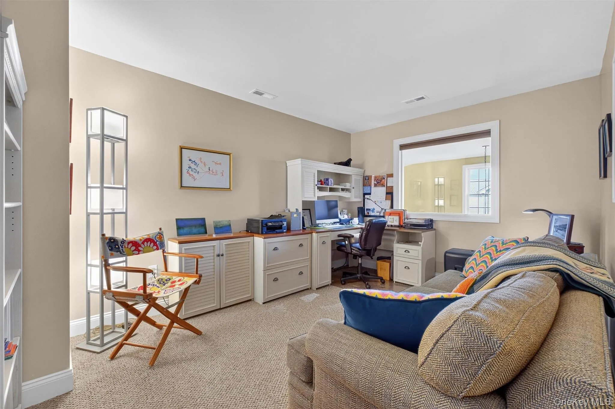 Home office with light colored carpet and baseboards Home office with light colored carpet and baseboards