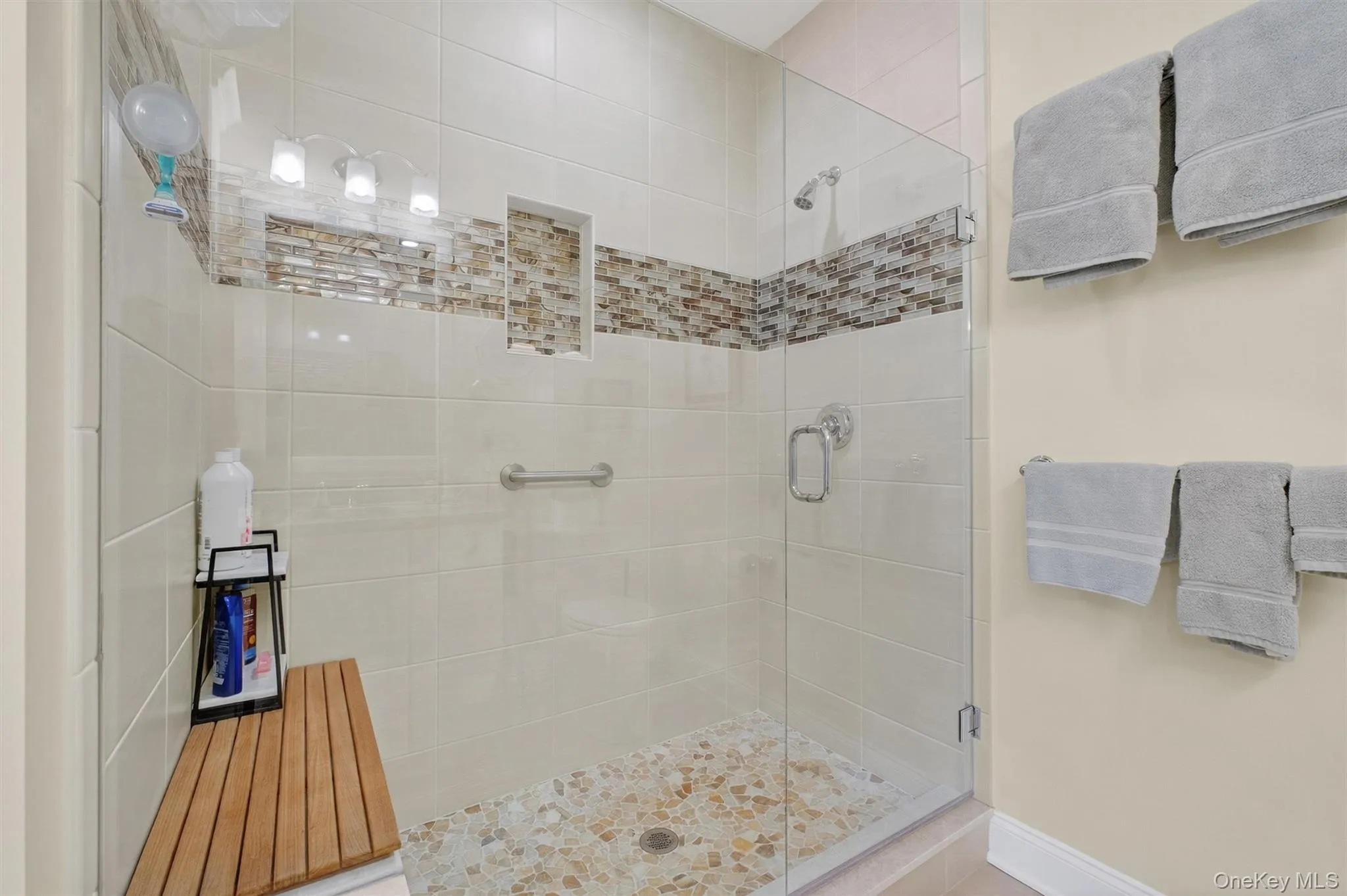 Bathroom featuring a shower stall Bathroom featuring a shower stall