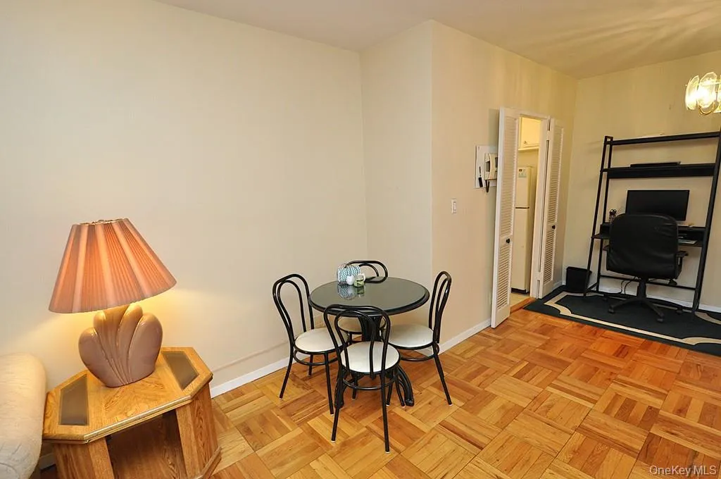 Living room and dining area have Eastern Views and parquet floors. The room is approx. 18'-9" x 11'-3" Living room and dining area have Eastern Views and parquet floors. The room is approx. 18'-9" x 11'-3"