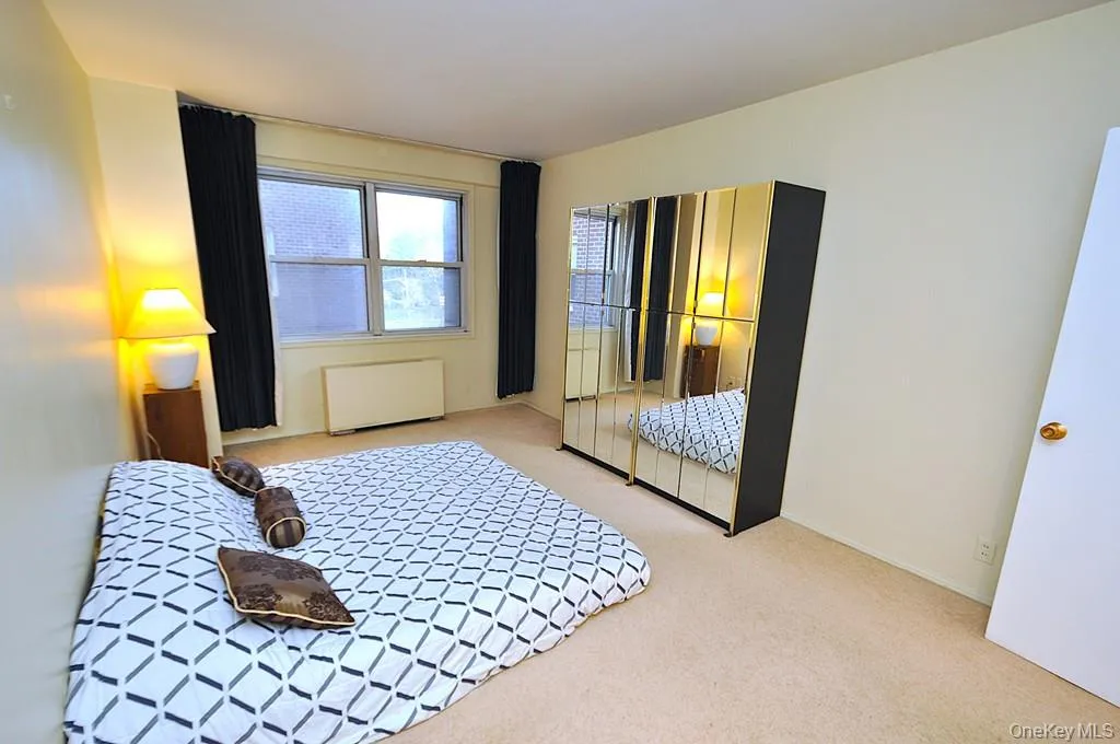 The bedroom has two large closets and covered parquet floors and is approx. 16'-8" x 10'-10". The bedroom has two large closets and covered parquet floors and is approx. 16'-8" x 10'-10".