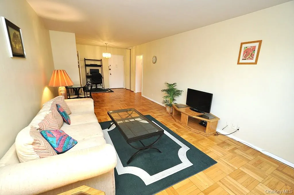 Living room and dining area have Eastern Views and parquet floors. The room is approx. 18'-9" x 11'-3" Living room and dining area have Eastern Views and parquet floors. The room is approx. 18'-9" x 11'-3"