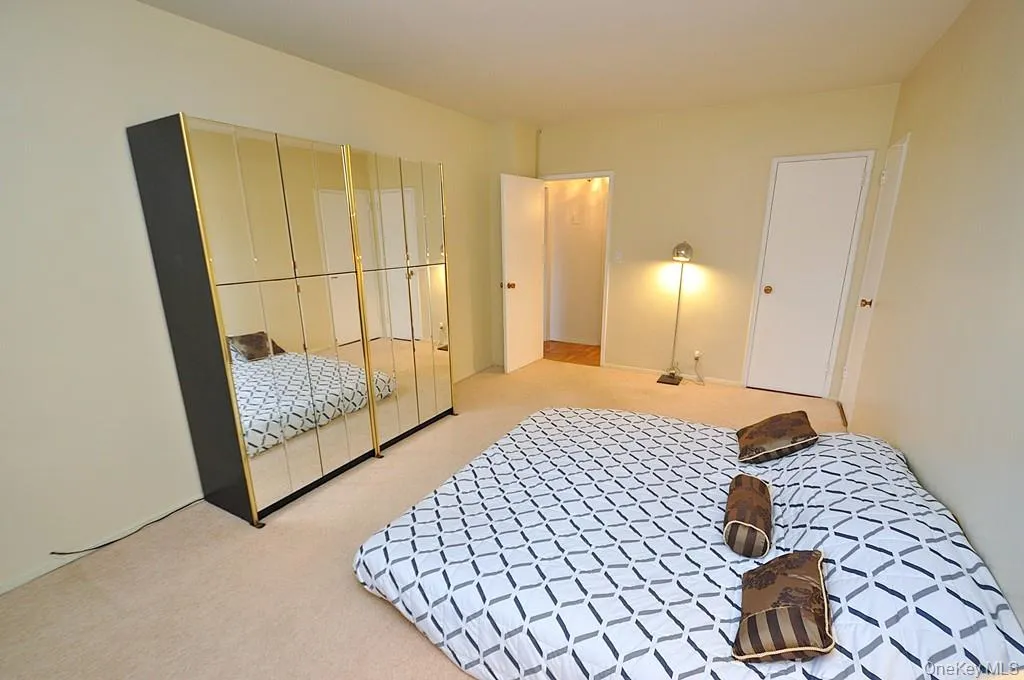 The bedroom has two large closets and covered parquet floors and is approx. 16'-8" x 10'-10". The bedroom has two large closets and covered parquet floors and is approx. 16'-8" x 10'-10".