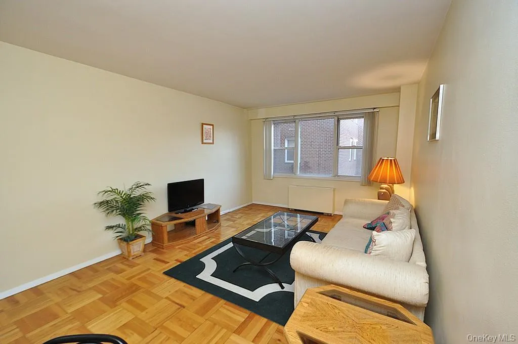 Living room and dining area have Eastern Views and parquet floors. The room is approx. 18'-9" x 11'-3" Living room and dining area have Eastern Views and parquet floors. The room is approx. 18'-9" x 11'-3"