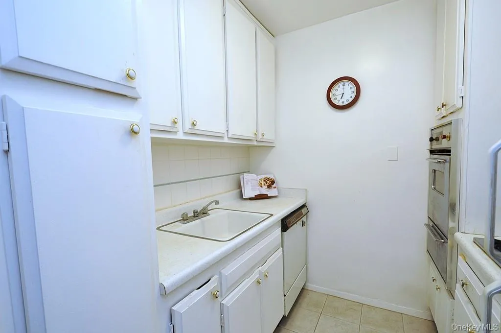 Kitchen has a refrigerator, stove top and wall oven. Kitchen has a refrigerator, stove top and wall oven.
