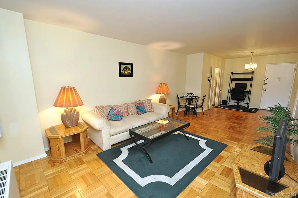 Living room and dining area have Eastern Views and parquet floors. The room is approx. 18'-9" x 11'-3" Living room and dining area have Eastern Views and parquet floors. The room is approx. 18'-9" x 11'-3"