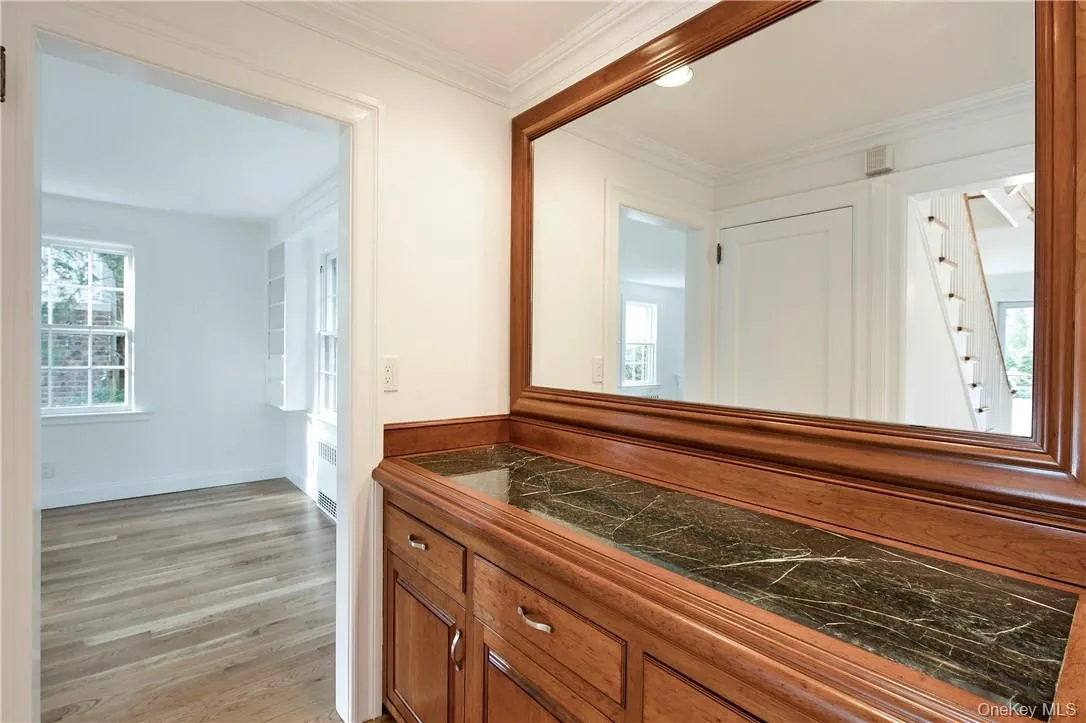Built-in Bar Area with Cherrywood cabinets in Hallway located between Living Room and large Family Room Area. Built-in Bar Area with Cherrywood cabinets in Hallway located between Living Room and large Family Room Area.