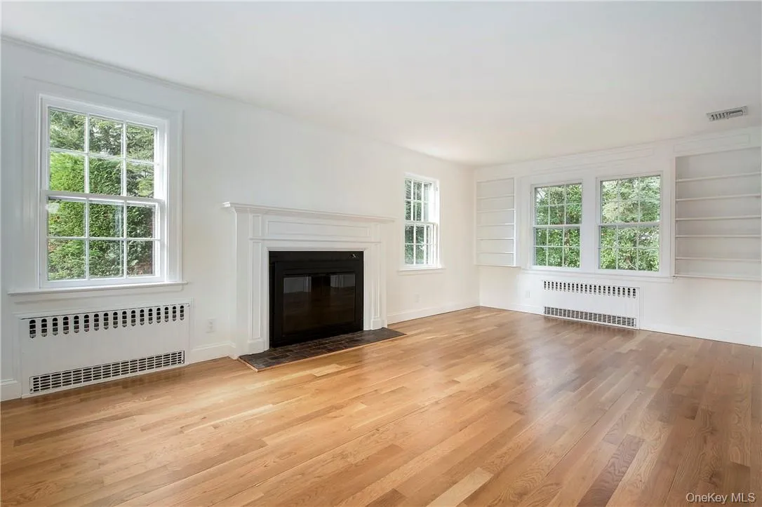 Living Room features windows on three sides for plenty of natural light all day long. Living Room features windows on three sides for plenty of natural light all day long.