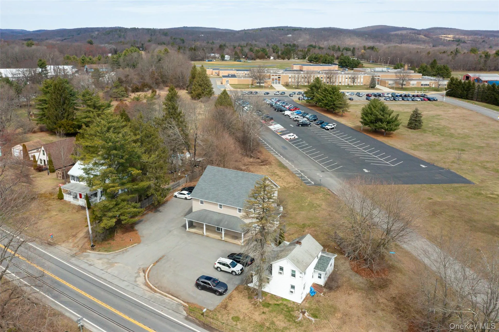 Birds eye view of property with school in background. Birds eye view of property with school in background.