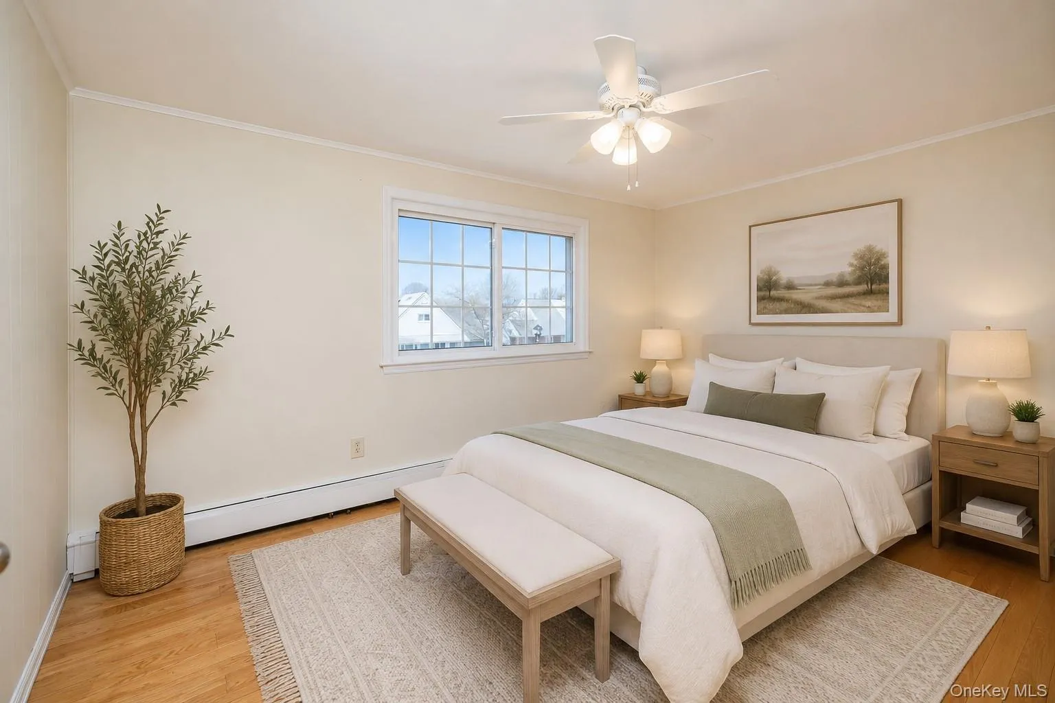 Bright and inviting bedroom featuring hardwood floors, abundant natural light, and ample space for a full bedroom set. Thoughtfully staged with elegant furnishings and neutral décor, creating a warm and relaxing retreat. Bright and inviting bedroom featuring hardwood floors, abundant natural light, and ample space for a full bedroom set. Thoughtfully staged with elegant furnishings and neutral décor, creating a warm and relaxing retreat.