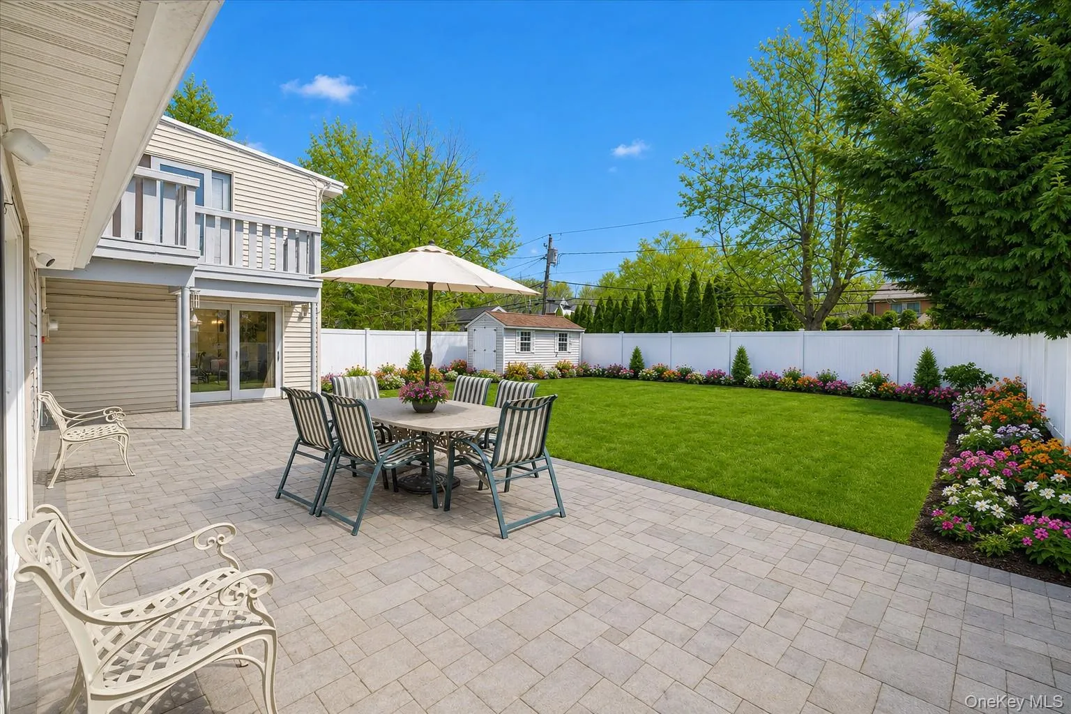Enjoy your own private outdoor oasis featuring a spacious paver patio, expansive fenced yard, and beautifully landscaped grounds. Perfect for entertaining, outdoor dining, gardening, or simply relaxing in a serene setting with plenty of room for recreation and gatherings. Enjoy your own private outdoor oasis featuring a spacious paver patio, expansive fenced yard, and beautifully landscaped grounds. Perfect for entertaining, outdoor dining, gardening, or simply relaxing in a serene setting with plenty of room for recreation and gatherings.