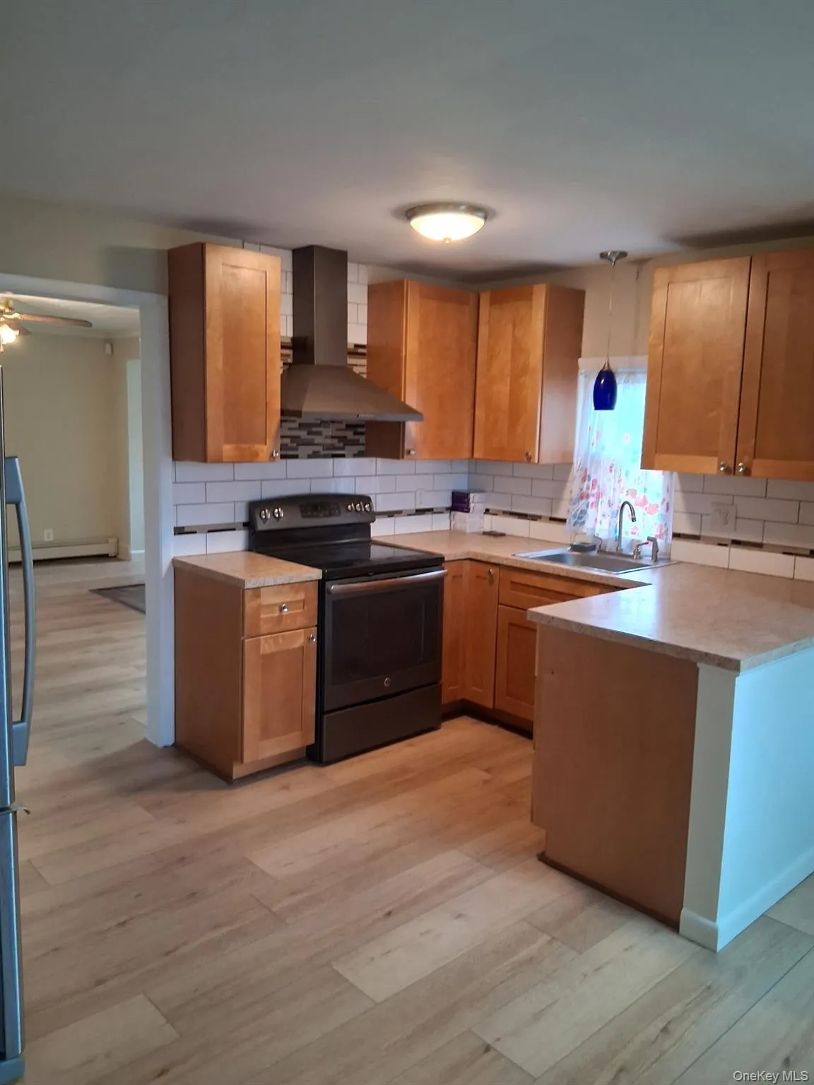 Kitchen with an electric range and oven Kitchen with an electric range and oven