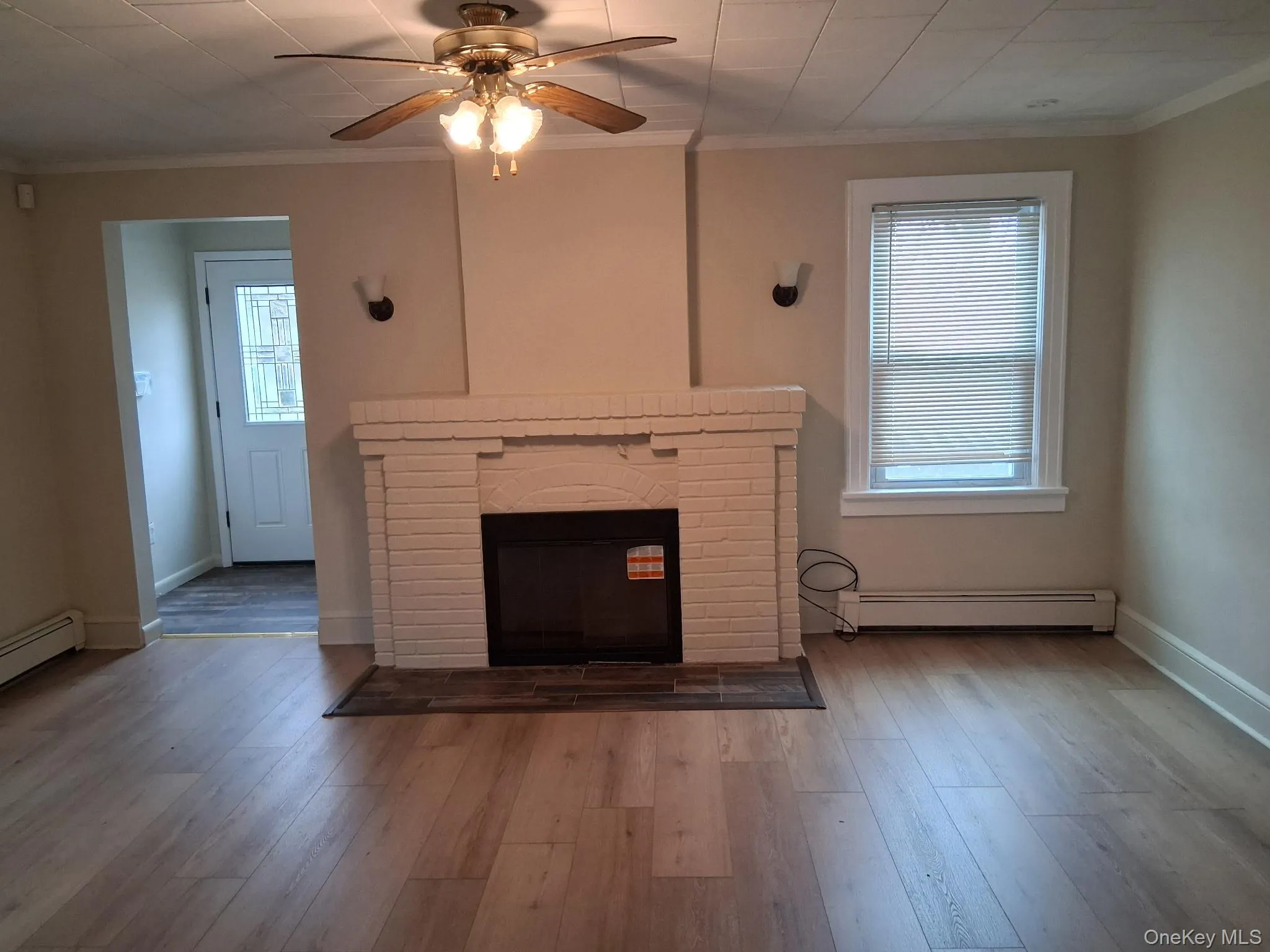 Living room with wood-burning fireplace. Living room with wood-burning fireplace.