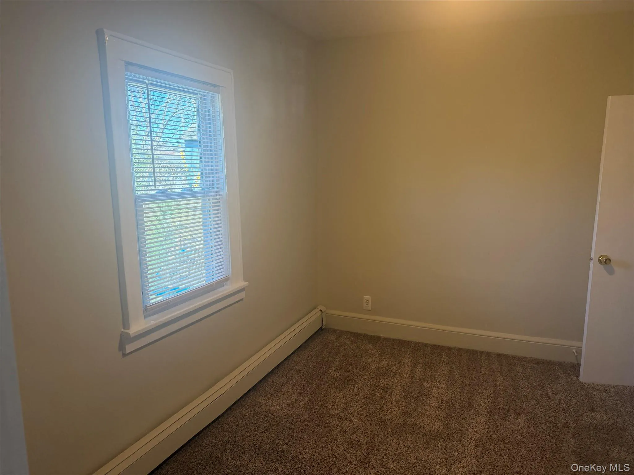 Unfurnished 2nd bedroom with a window and a closet. Fresh paint and carpet Unfurnished 2nd bedroom with a window and a closet. Fresh paint and carpet