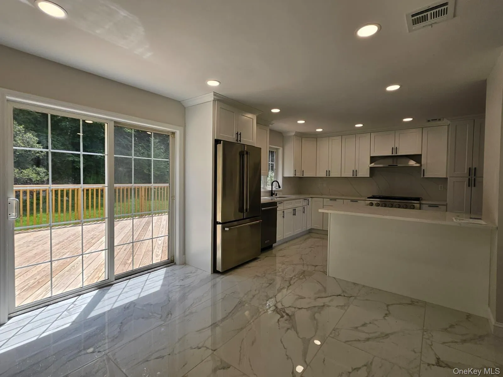 Breakfast nook and kitchen at sliding door to Deck Breakfast nook and kitchen at sliding door to Deck