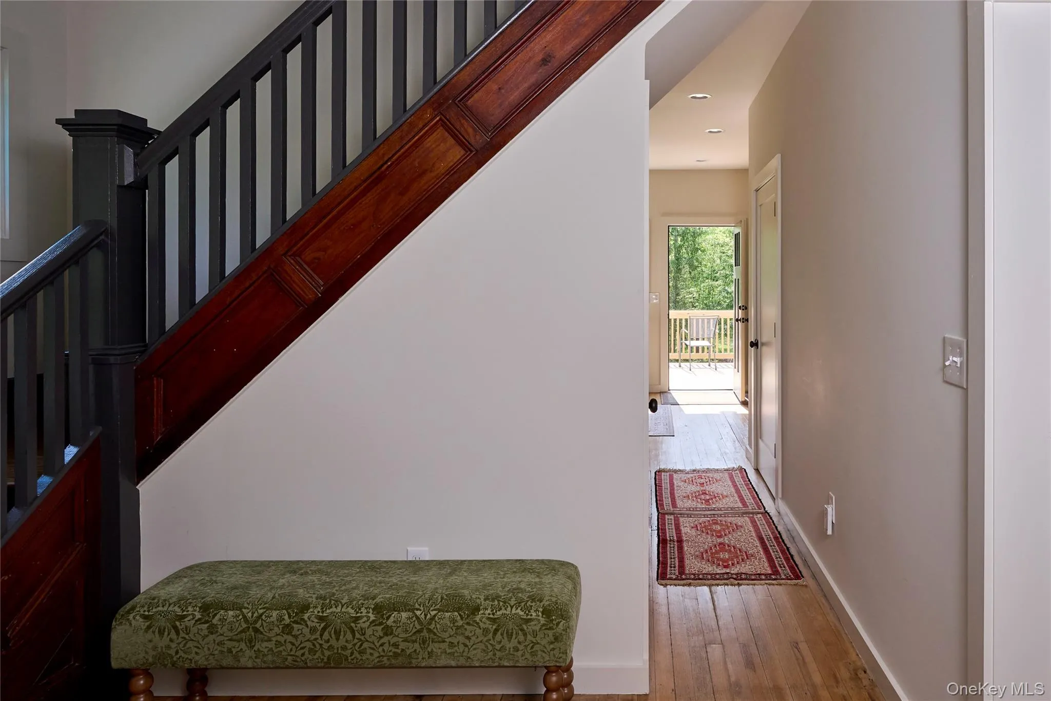 Stairs featuring wood finished floors, baseboards, and recessed lighting Stairs featuring wood finished floors, baseboards, and recessed lighting
