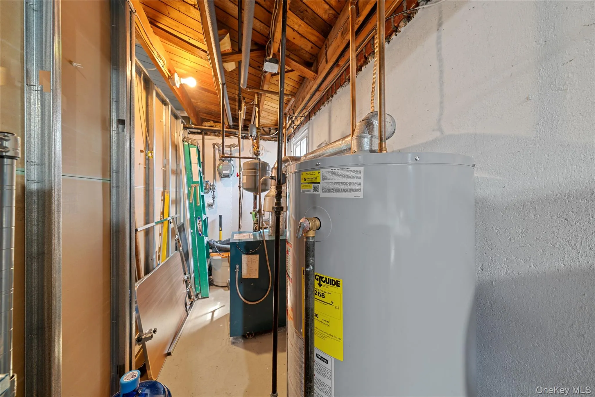 Utilities featuring gas water heater and a heating unit Utilities featuring gas water heater and a heating unit