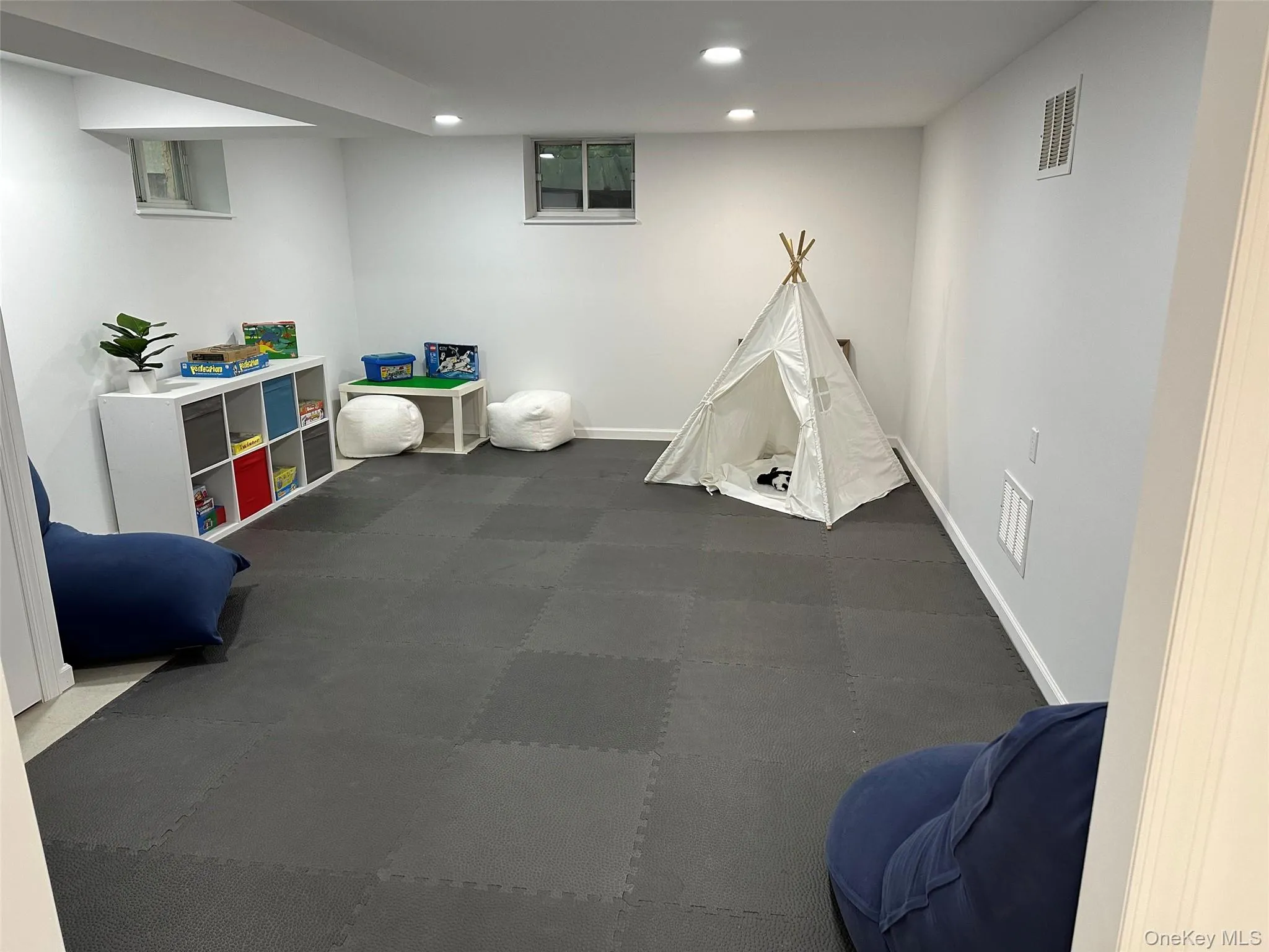 Rec room featuring recessed lighting and baseboards Rec room featuring recessed lighting and baseboards