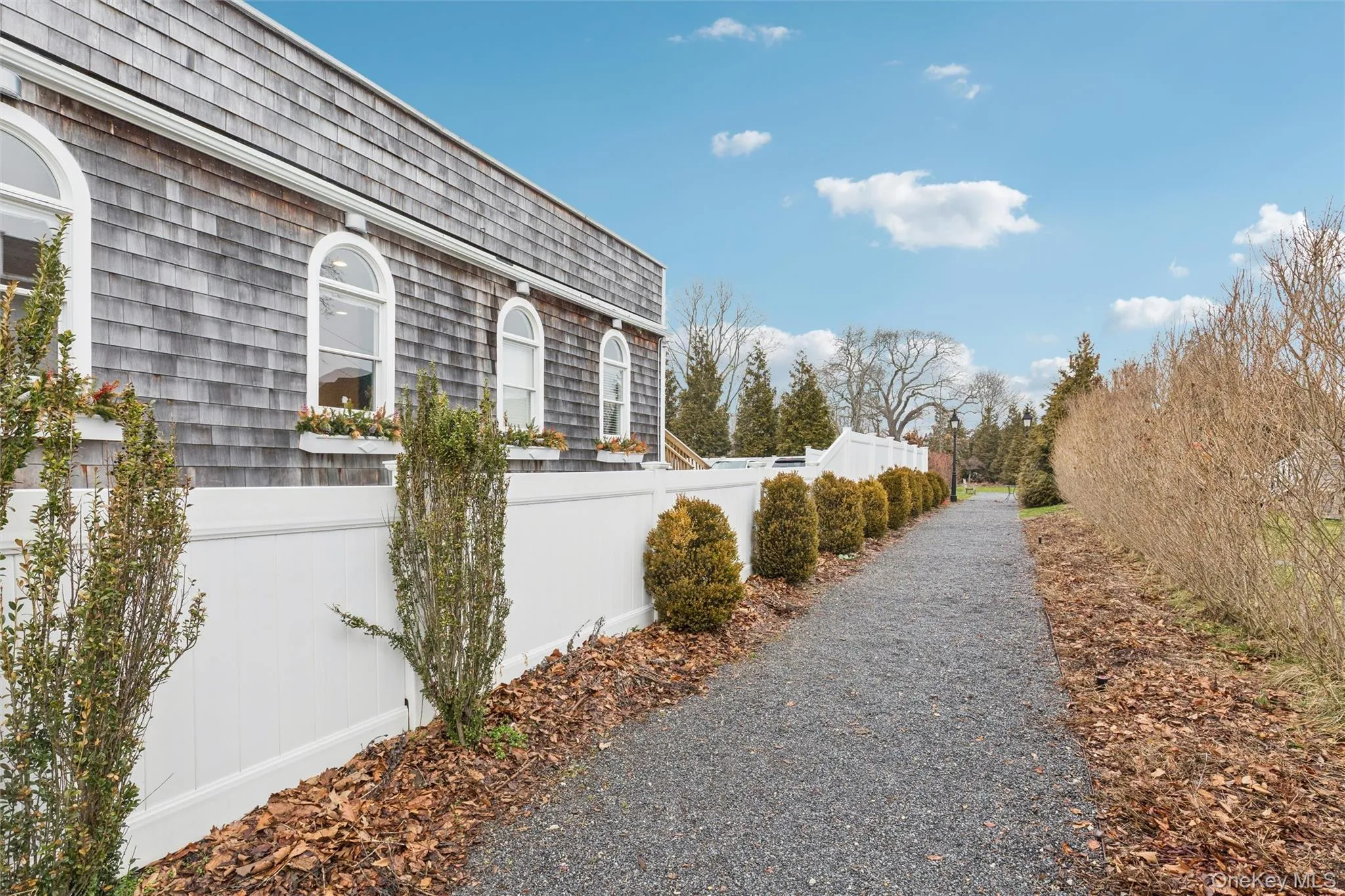 Pathway to peaceful park and fountain behind the buliding Pathway to peaceful park and fountain behind the buliding