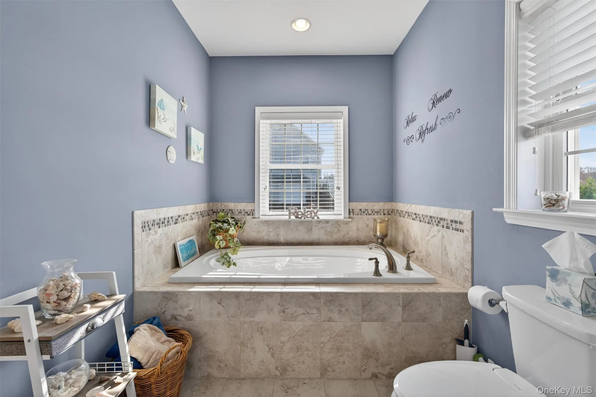 Bathroom with a bath and toilet Bathroom with a bath and toilet