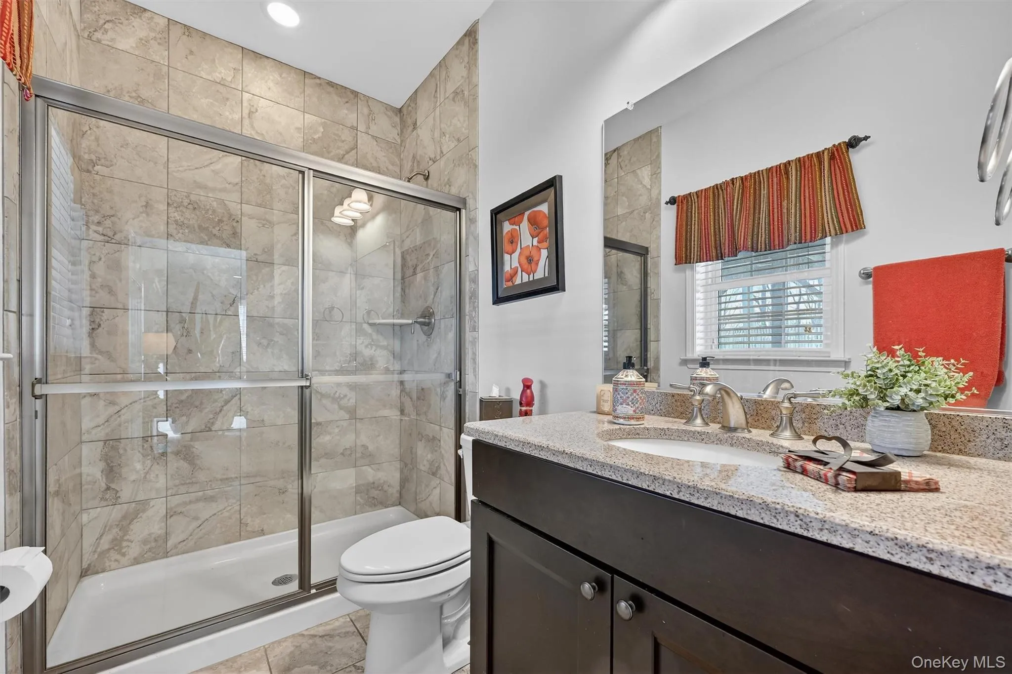 Full bath with vanity, a stall shower, light tile patterned floors, and recessed lighting Full bath with vanity, a stall shower, light tile patterned floors, and recessed lighting