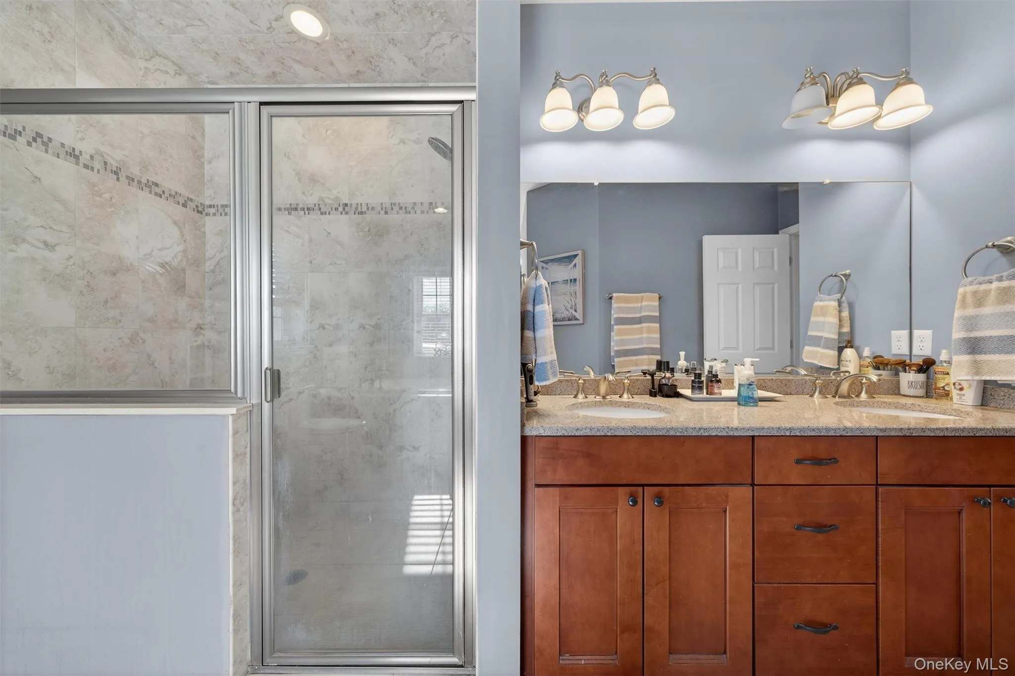 Full bath with double vanity and a shower stall Full bath with double vanity and a shower stall