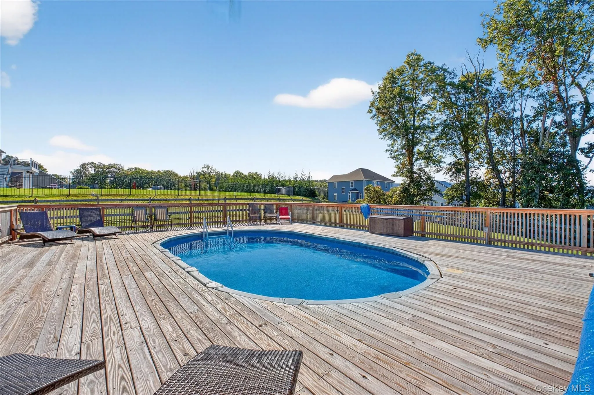 View of swimming pool with a wooden deck View of swimming pool with a wooden deck
