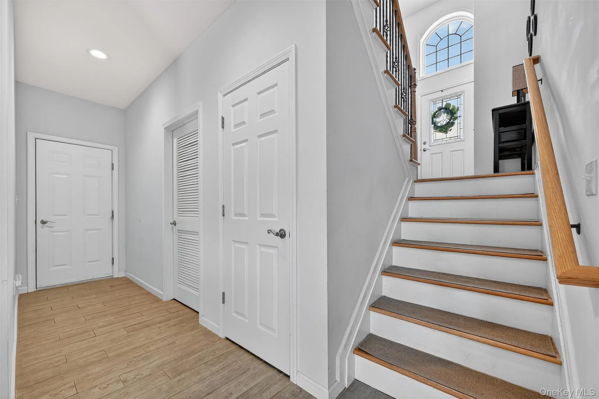 Staircase featuring wood finished floors and baseboards Staircase featuring wood finished floors and baseboards