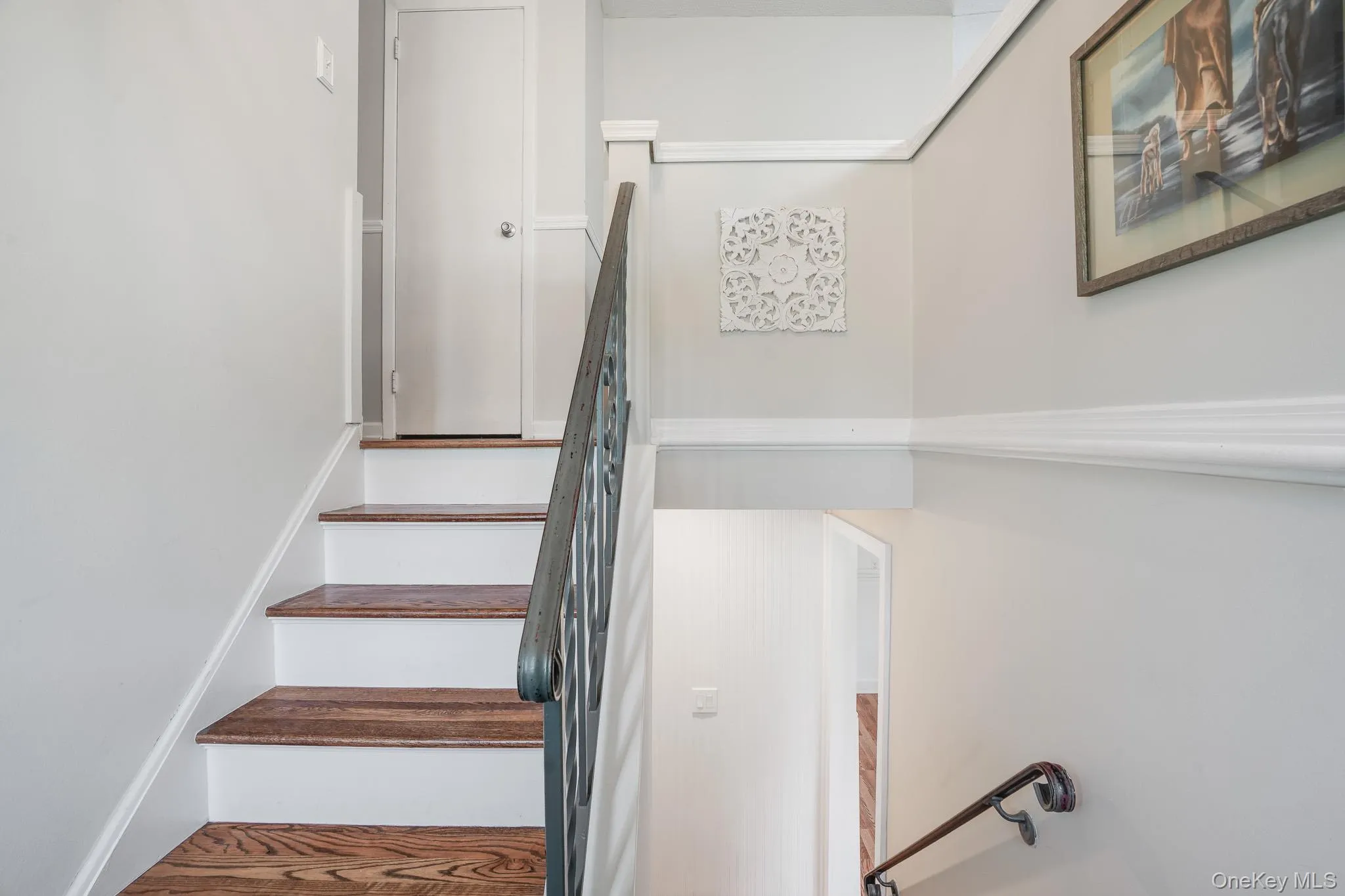 Staircase with wood-finish treads and white risers Staircase with wood-finish treads and white risers