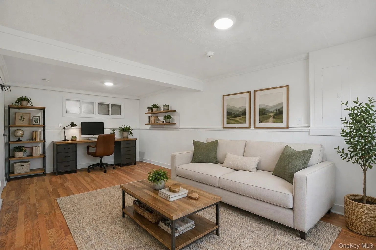 Living space featuring wood-finish flooring, recessed lighting, and white wainscoting Living space featuring wood-finish flooring, recessed lighting, and white wainscoting