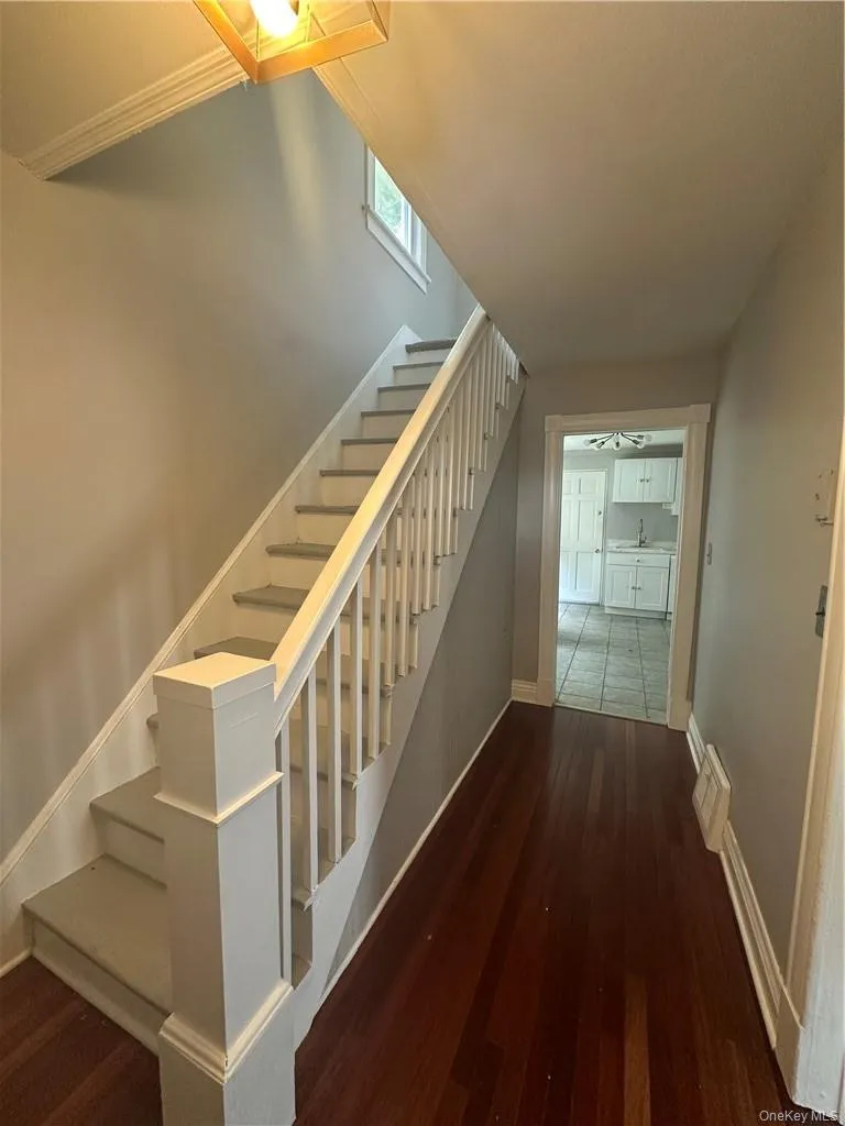 Entry Foyer with views into kitchen. Living room to the right Entry Foyer with views into kitchen. Living room to the right