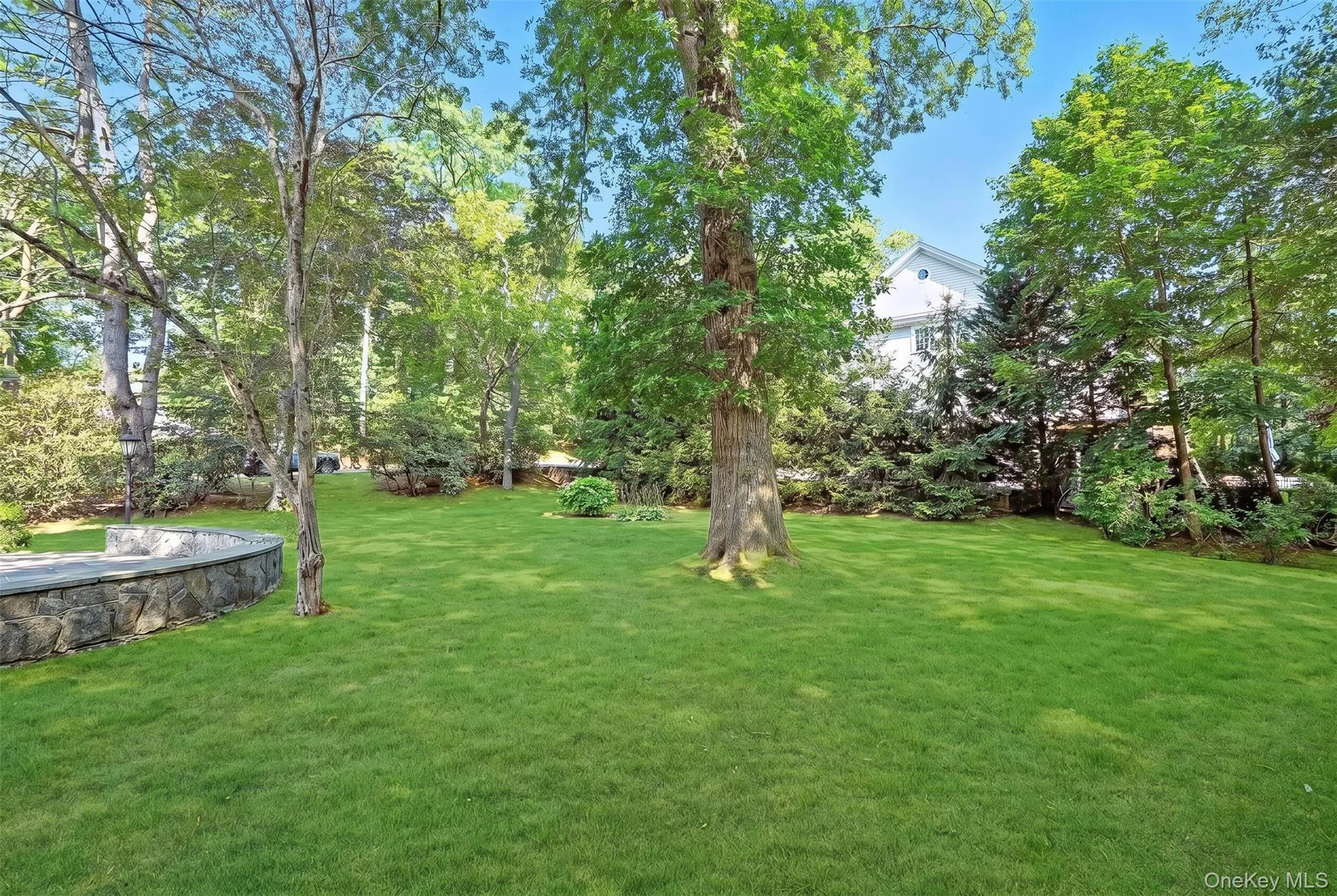 Alternate View of Spacious Level Yard with Mature Plantings. Alternate View of Spacious Level Yard with Mature Plantings.