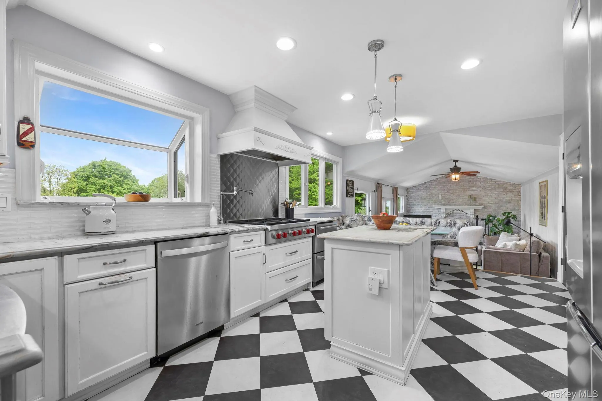 Stainless steel appliances, eat in breakfast nook with banquet seating Stainless steel appliances, eat in breakfast nook with banquet seating