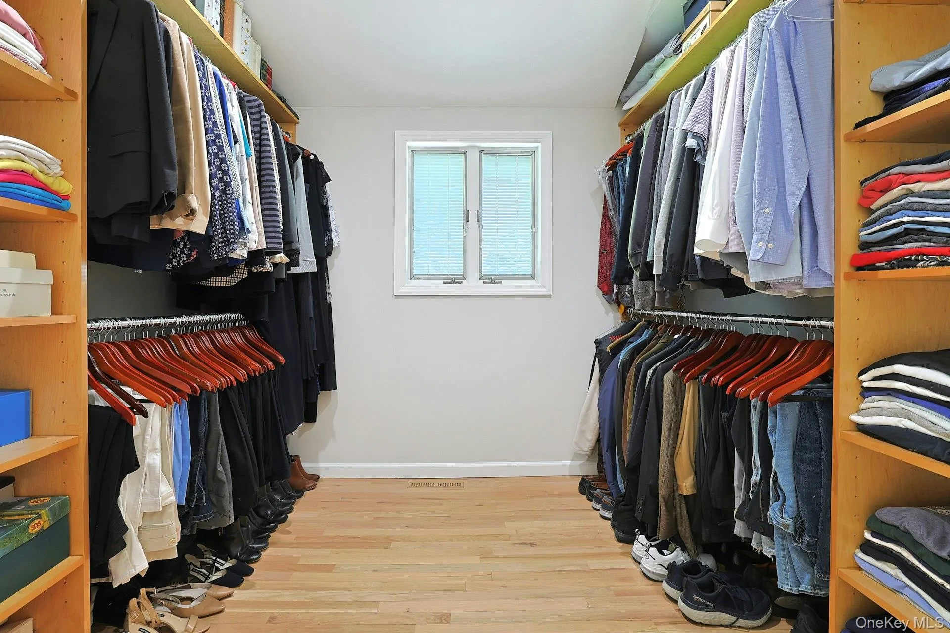 Generous walk- in closet with pocket door. Generous walk- in closet with pocket door.