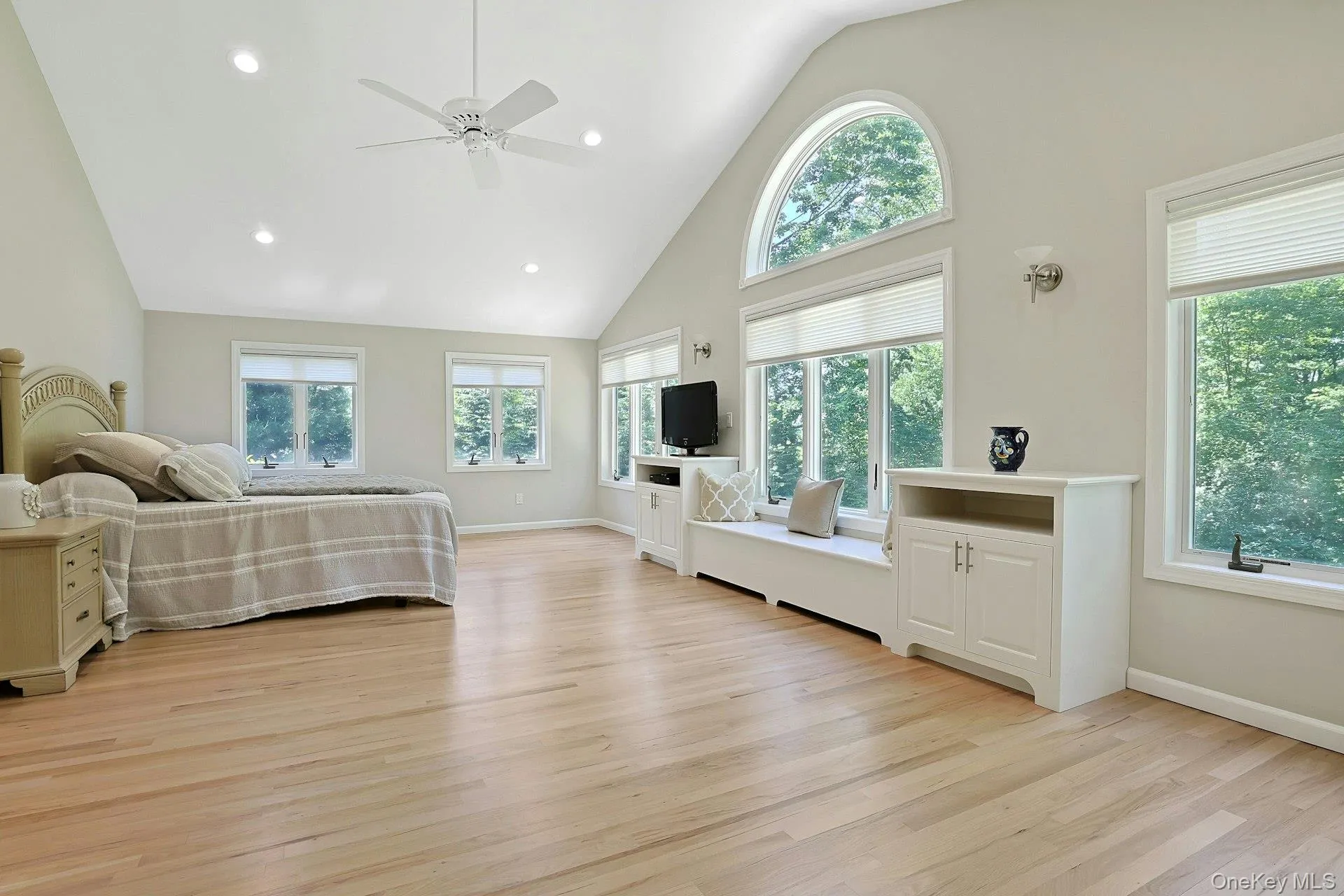 Oversized primary suite. Windows of natural light, gleaming oak floors, custom shades, ceiling fan,custom cabinetry and window seat for additional storage. Oversized primary suite. Windows of natural light, gleaming oak floors, custom shades, ceiling fan,custom cabinetry and window seat for additional storage.