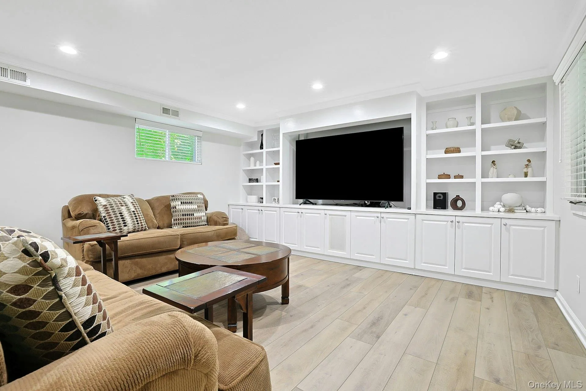 Built in custom cabinetry/TV space , recessed LED lighting and vinyl floating floor. Built in custom cabinetry/TV space , recessed LED lighting and vinyl floating floor.
