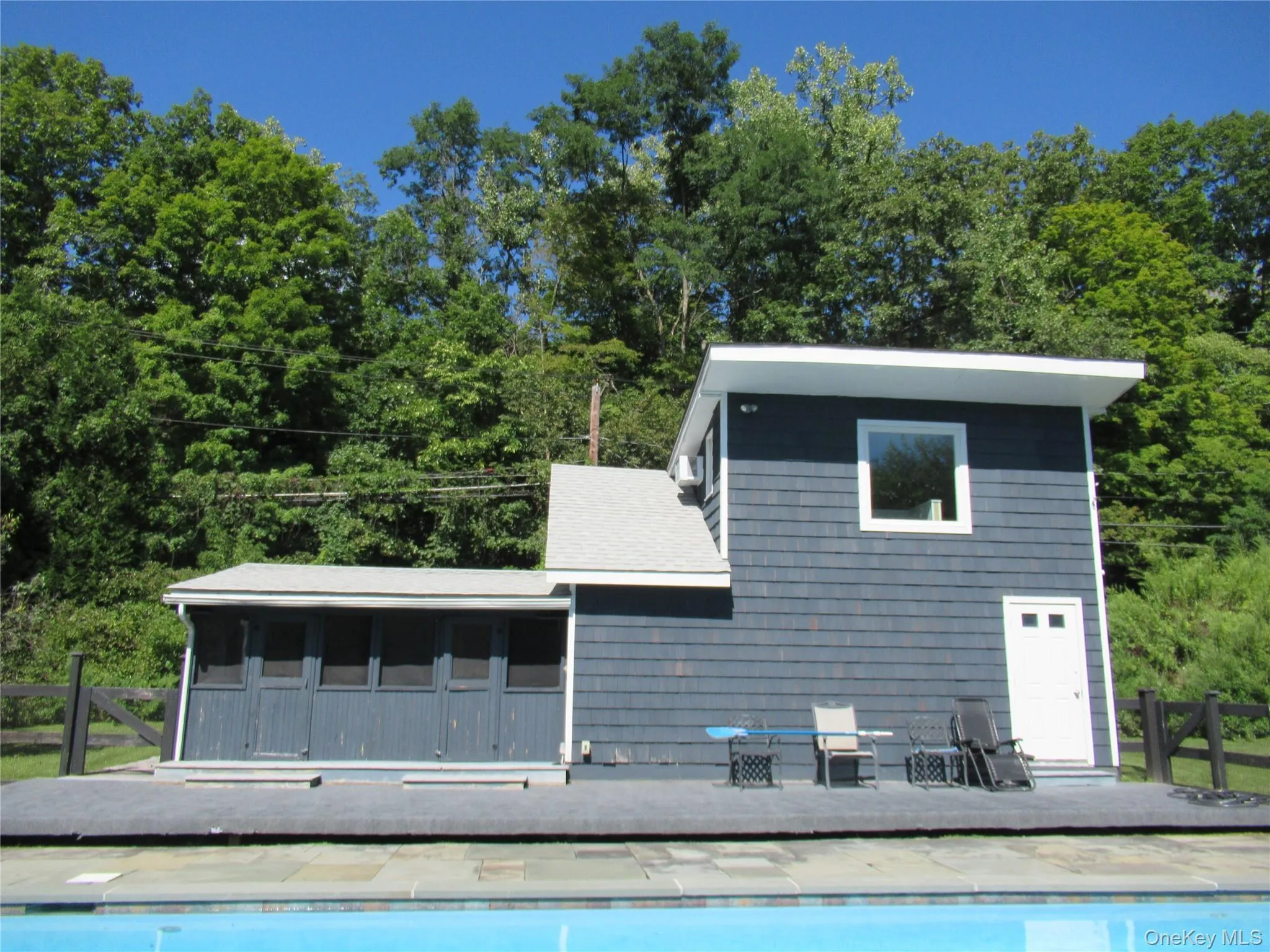 Opens up directly to fenced in pool area Opens up directly to fenced in pool area