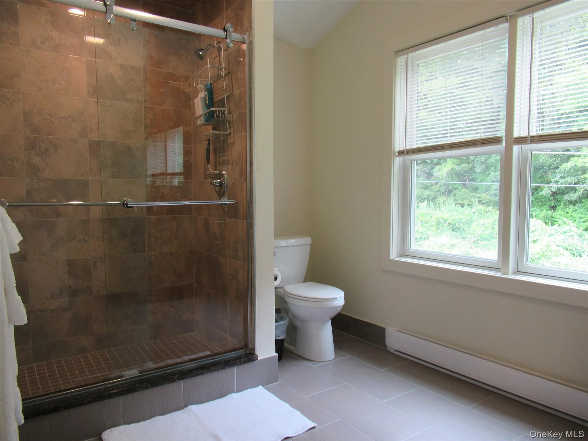 Full bath for bedroom #1 with walk in tile shower. Full bath for bedroom #1 with walk in tile shower.