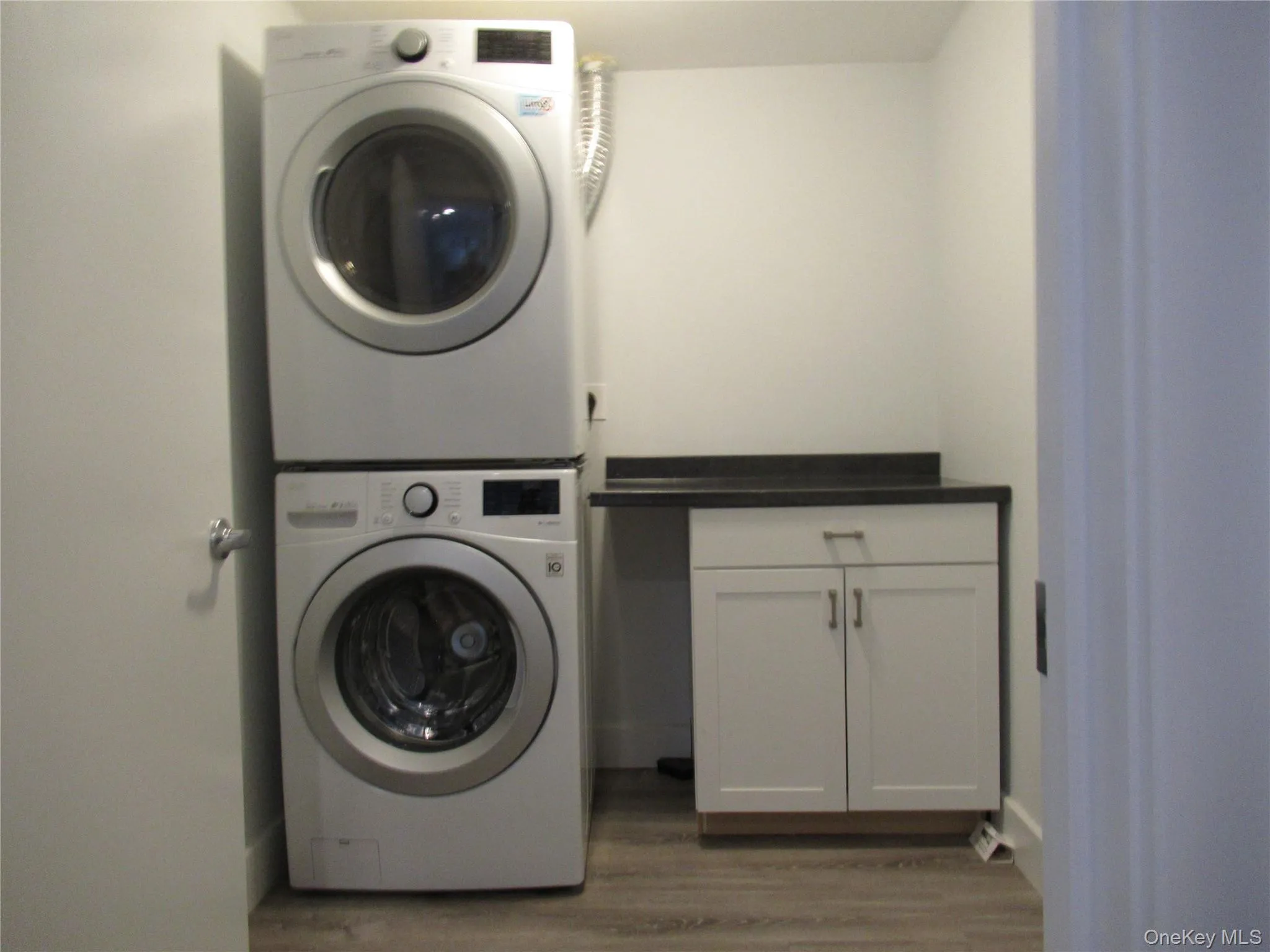 Laundry room with storage cabinet Laundry room with storage cabinet