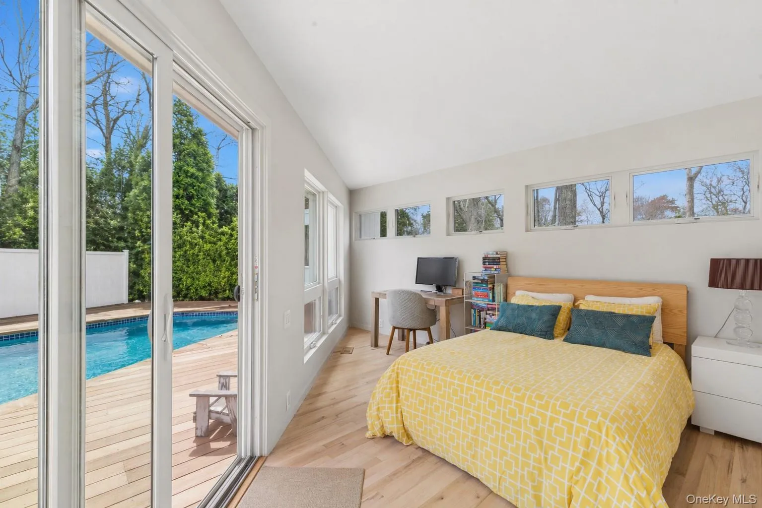 Bedroom with sliding glass doors to pool area. Bedroom with sliding glass doors to pool area.