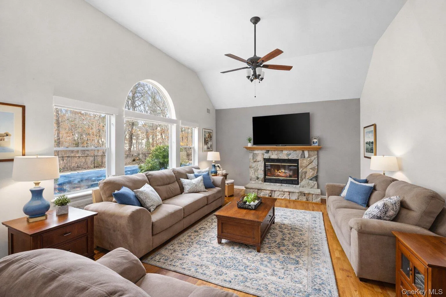 Living room with Wood brunng Fireplace - Photo has been staged Living room with Wood brunng Fireplace - Photo has been staged