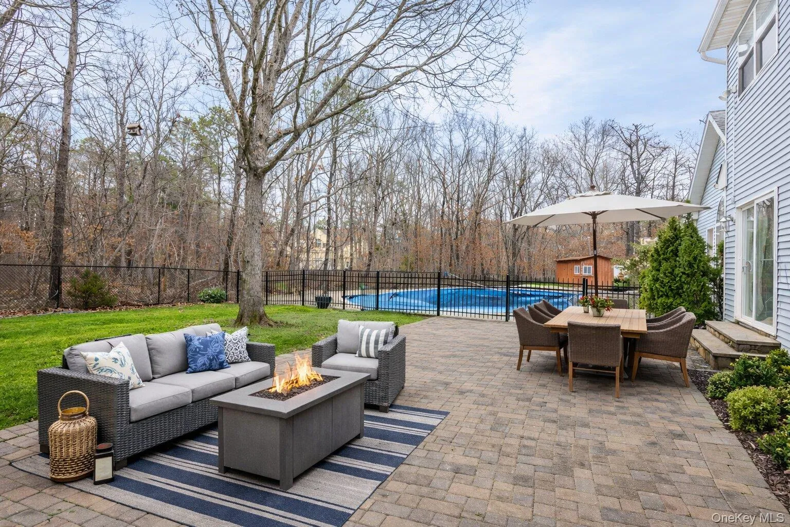 Paver Patio and gated pool area - Photo has been staged Paver Patio and gated pool area - Photo has been staged