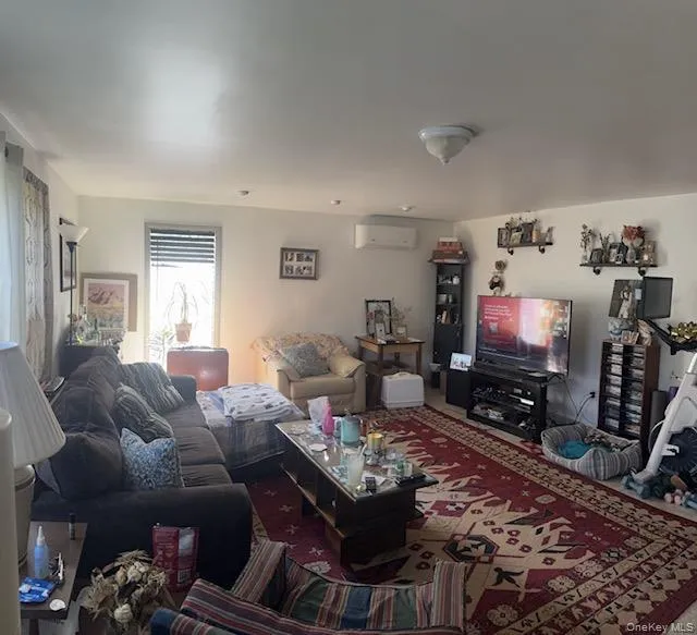 Living area with a wall mounted AC Living area with a wall mounted AC