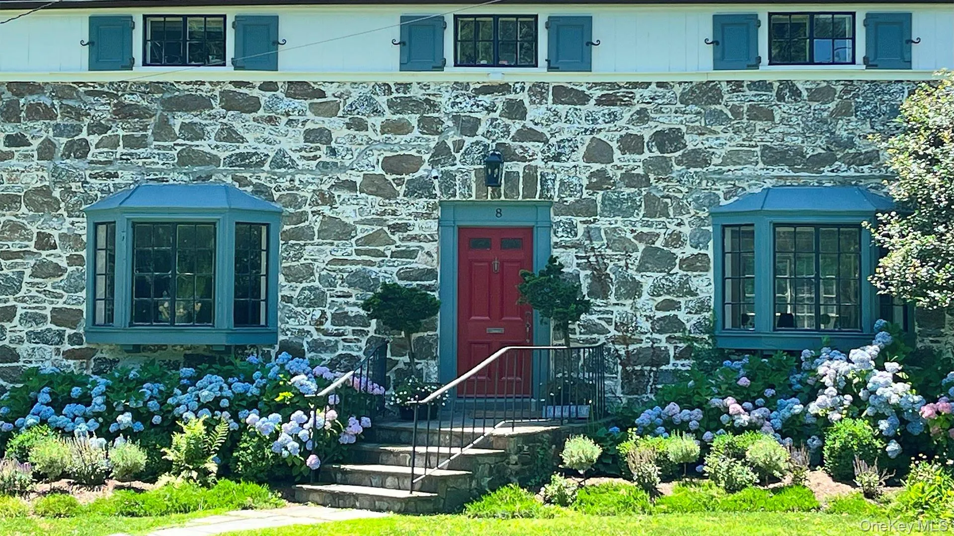 Property entrance featuring stone siding Property entrance featuring stone siding